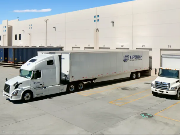 Updike Distribution Logistics semi truck at a warehouse loading dock